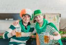 positive guys drinking beer and celebrating st patricks day